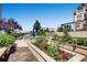Beautiful courtyard featuring lush garden beds, a tranquil fountain, and meticulously maintained landscaping at 925 N Lincoln St # 8E-S, Denver, CO 80203