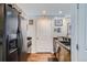 This kitchen features granite countertops, stainless steel appliances, and wood-look flooring at 925 N Lincoln St # 8E-S, Denver, CO 80203