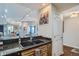 Modern kitchen area with granite countertops and a view into other living spaces at 925 N Lincoln St # 8E-S, Denver, CO 80203