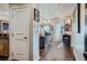 Open-concept space with hardwood floors leading to a sunlit living room with modern furniture at 925 N Lincoln St # 8E-S, Denver, CO 80203