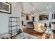 Open-concept living space with hardwood floors and modern decor, leading into the kitchen at 925 N Lincoln St # 8E-S, Denver, CO 80203