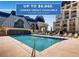 Inviting pool area with ample seating and well-maintained landscaping at this luxurious community at 925 N Lincoln St # 8E-S, Denver, CO 80203