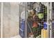 Organized storage unit with personal items secured behind a wire mesh for security and convenient storage at 925 N Lincoln St # 8E-S, Denver, CO 80203