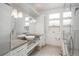 Bathroom features dual sinks, large mirror, and a shower with glass enclosure at 844 N Humboldt St # 5, Denver, CO 80218
