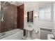 Bathroom features pedestal sink, tiled shower and frosted window at 844 N Humboldt St # 5, Denver, CO 80218
