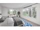 Bedroom offers large windows and a view of the lush, mature greenery outdoors at 844 N Humboldt St # 5, Denver, CO 80218