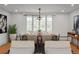 Well-lit dining room showcasing large windows, hardwood floors, and stylish chandelier at 844 N Humboldt St # 5, Denver, CO 80218