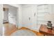 Inviting entryway boasts hardwood floors, built-in shelving, and access to a spacious living area at 844 N Humboldt St # 5, Denver, CO 80218