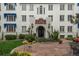 Elegant exterior with a well-manicured lawn, stone patio, and vibrant flower beds adds curb appeal at 844 N Humboldt St # 5, Denver, CO 80218