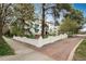 Charming building with a red brick driveway, mature trees, and beautiful landscaping at 844 N Humboldt St # 5, Denver, CO 80218