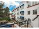 Unique building architecture with brick patio and walkways and blue awnings at 844 N Humboldt St # 5, Denver, CO 80218