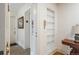 Hallway with elevator access showcases built-in shelving and an antique table with a lamp at 844 N Humboldt St # 5, Denver, CO 80218