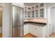 Kitchen features include stainless steel refrigerator, granite countertops and white cabinetry at 844 N Humboldt St # 5, Denver, CO 80218