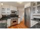 Beautiful kitchen featuring stainless steel appliances, white cabinets, and stone countertops at 844 N Humboldt St # 5, Denver, CO 80218