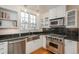 Modern kitchen with stainless steel appliances, stone countertops, hardwood floors and lots of light at 844 N Humboldt St # 5, Denver, CO 80218