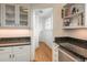 Kitchen features granite countertops, white cabinetry, stainless steel appliances and hardwood floors at 844 N Humboldt St # 5, Denver, CO 80218