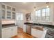 Bright kitchen with stainless steel appliances, granite countertops and white cabinetry at 844 N Humboldt St # 5, Denver, CO 80218