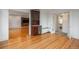 Open-concept living area showcasing hardwood floors, mini-bar, and seamless transition to adjacent rooms at 844 N Humboldt St # 5, Denver, CO 80218