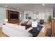 Bright living room with hardwood floors, built-in shelving, and a dining area is perfect for entertaining at 844 N Humboldt St # 5, Denver, CO 80218