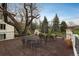 Spacious patio area with dining and relaxing furniture, beautiful treetop and golf course views at 844 N Humboldt St # 5, Denver, CO 80218