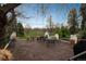 Spacious patio area with dining and relaxing furniture, beautiful treetop and golf course views at 844 N Humboldt St # 5, Denver, CO 80218