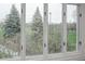 Large windows offer views of mature trees and greenery at 844 N Humboldt St # 5, Denver, CO 80218
