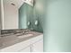 Stylish half bathroom features a modern vanity, sleek mirror, and contemporary design at 2004 Foxtail Ln # B, Lafayette, CO 80026