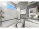Bright bathroom featuring a shower-tub combo, white subway tiles, and modern fixtures at 2004 Foxtail Ln # B, Lafayette, CO 80026
