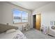 Charming bedroom with a large window, neutral colors, and a playful atmosphere at 2004 Foxtail Ln # B, Lafayette, CO 80026