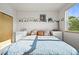 Cozy bedroom featuring a large bed, stylish decor, and ample natural light at 2004 Foxtail Ln # B, Lafayette, CO 80026