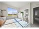 Bright bedroom offers a view and an en-suite bathroom at 2004 Foxtail Ln # B, Lafayette, CO 80026