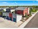 Striking exterior of the home with three-car garage and garden at 2004 Foxtail Ln # B, Lafayette, CO 80026