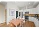 Bright kitchen with stainless steel appliances, white cabinets, and adjacent dining area at 2004 Foxtail Ln # B, Lafayette, CO 80026