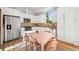 Modern kitchen features stainless steel appliances, white cabinets, and an adjacent dining area at 2004 Foxtail Ln # B, Lafayette, CO 80026