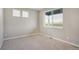 Bedroom featuring neutral walls, carpet, and a large window that offers abundant natural light at 13477 Valentia St, Thornton, CO 80602