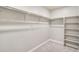Walk-in closet with built-in shelving offering lots of storage space at 13477 Valentia St, Thornton, CO 80602