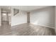 Spacious living room featuring modern wood floors, neutral walls, and lots of natural light at 13477 Valentia St, Thornton, CO 80602
