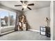 Bedroom with a large window and a ceiling fan at 6227 Shenandoah Ave, Firestone, CO 80504