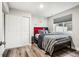 Cozy bedroom features wood floors, closet and a bright window at 6227 Shenandoah Ave, Firestone, CO 80504
