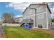 Back of the house featuring a deck, yard, and neutral siding at 6227 Shenandoah Ave, Firestone, CO 80504