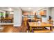 Spacious eat-in kitchen with an island, stainless steel appliances, and hardwood floors at 6227 Shenandoah Ave, Firestone, CO 80504