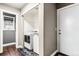 Convenient laundry area with a washer and dryer, complemented by a decorative laundry rug at 6227 Shenandoah Ave, Firestone, CO 80504