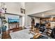 Open-concept living room seamlessly connects to dining area and kitchen, enhancing the home's flow at 6227 Shenandoah Ave, Firestone, CO 80504