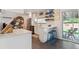 Bright, modern kitchen with quartz countertops and an adjacent dining area with access to the backyard at 806 S Jersey St, Denver, CO 80224
