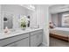 This bathroom has a white double vanity and modern faucets for your convenience at 8051 Yampa River Ave, Littleton, CO 80125