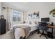 Bedroom featuring a modern desk setup and a comfortable queen-sized bed at 8051 Yampa River Ave, Littleton, CO 80125