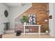 Stylish entryway featuring a wood accent wall, modern decor, and a welcoming ambiance at 8051 Yampa River Ave, Littleton, CO 80125