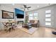 Bright living room featuring modern furniture, a fireplace, and seamless open-concept design at 8051 Yampa River Ave, Littleton, CO 80125