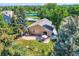 A well-maintained backyard with a patio, lush lawn, and garden beds, perfect for outdoor relaxation and entertaining at 8845 W 81St Dr, Arvada, CO 80005