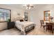 This bedroom features a metal frame bed with bedside tables and wood floors, offering a comfortable retreat at 8845 W 81St Dr, Arvada, CO 80005